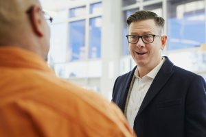 Two Men Talking on Focus Photography